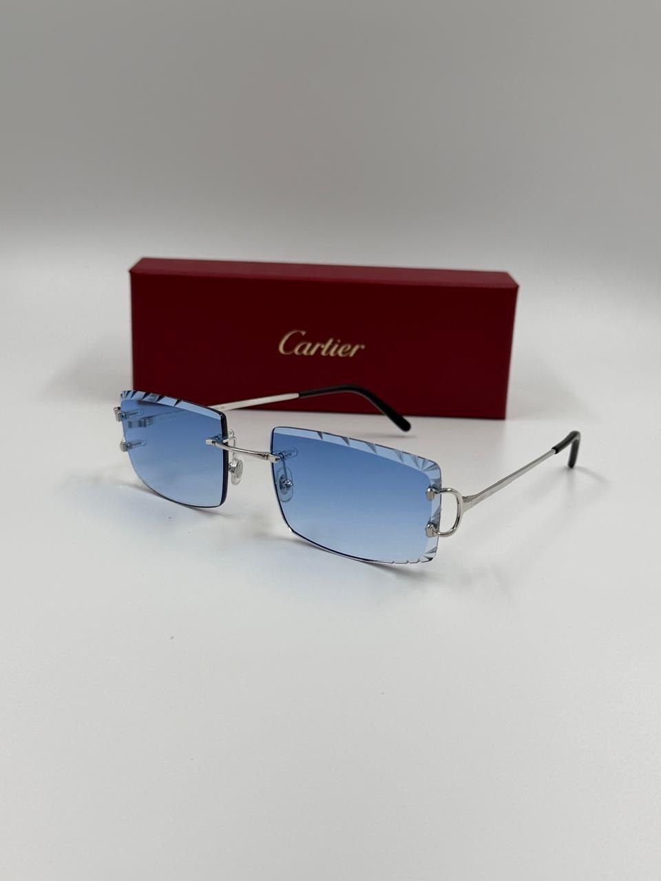 Eyewear beside a red presentation case