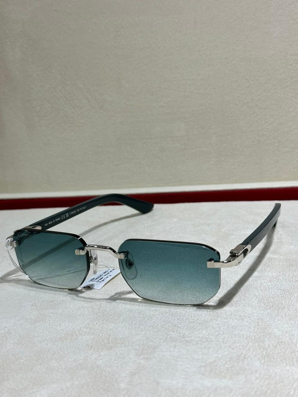 Blue-tinted glasses on a presentation surface