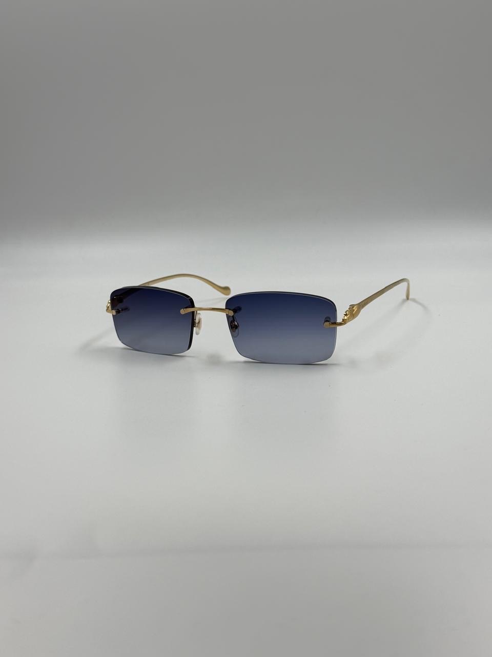 Blue-lensed square sunglasses with a fine metal frame