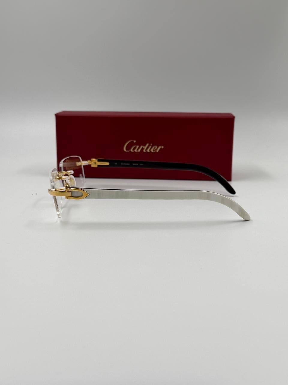 Eyeglasses on a pale studio surface