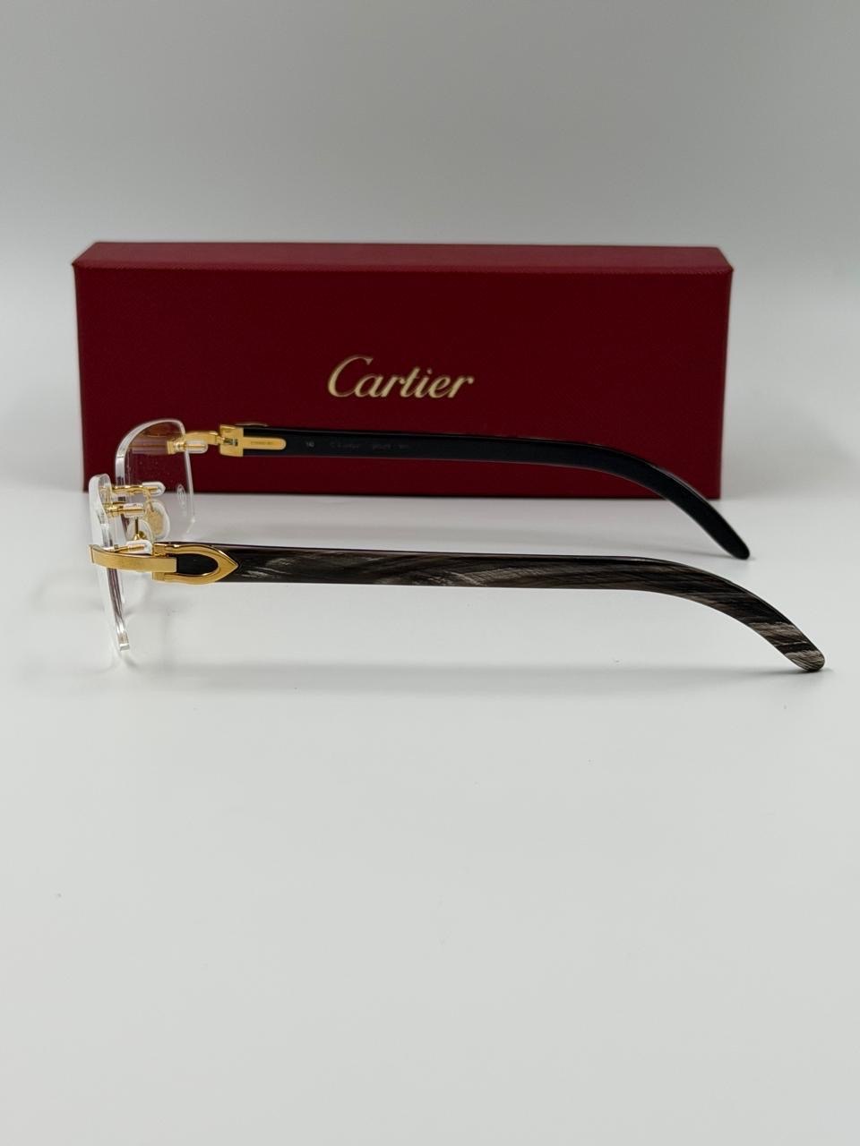 Eyewear shown beside a red presentation case