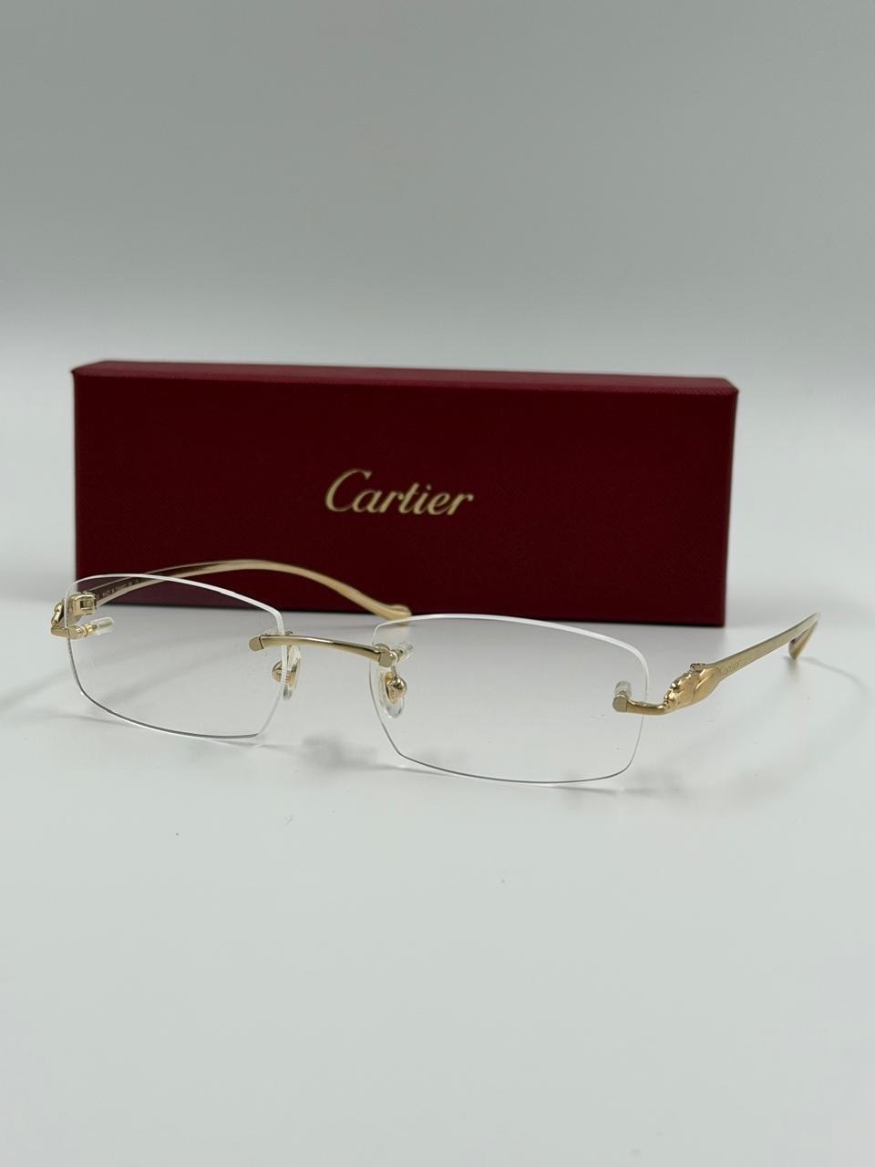 Detail of glasses beside a red case
