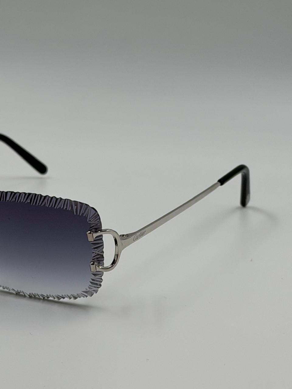 Dark-lensed sunglasses in profile