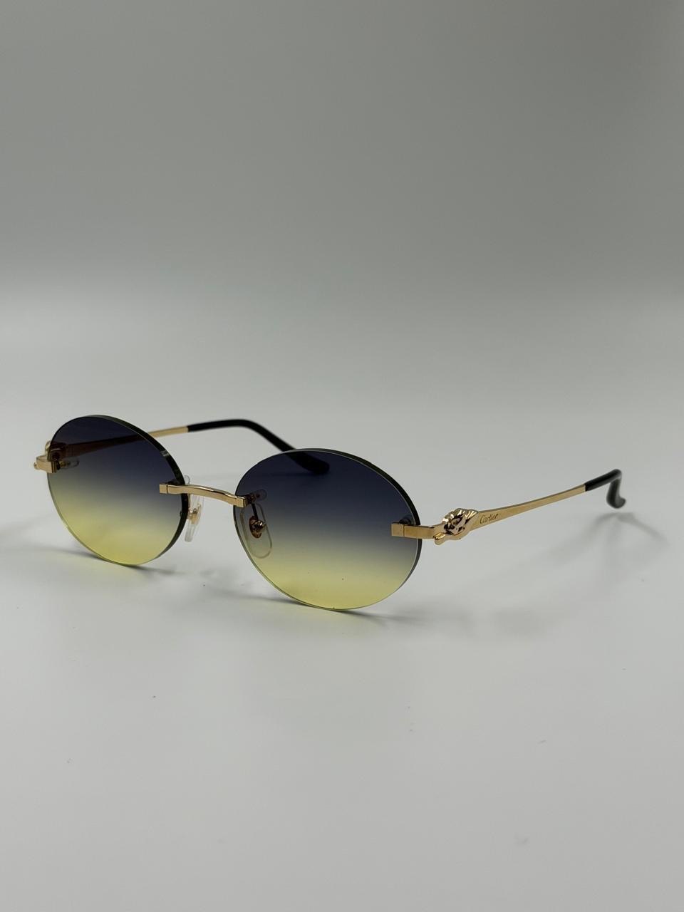 Gold-toned sunglasses with softly coloured lenses