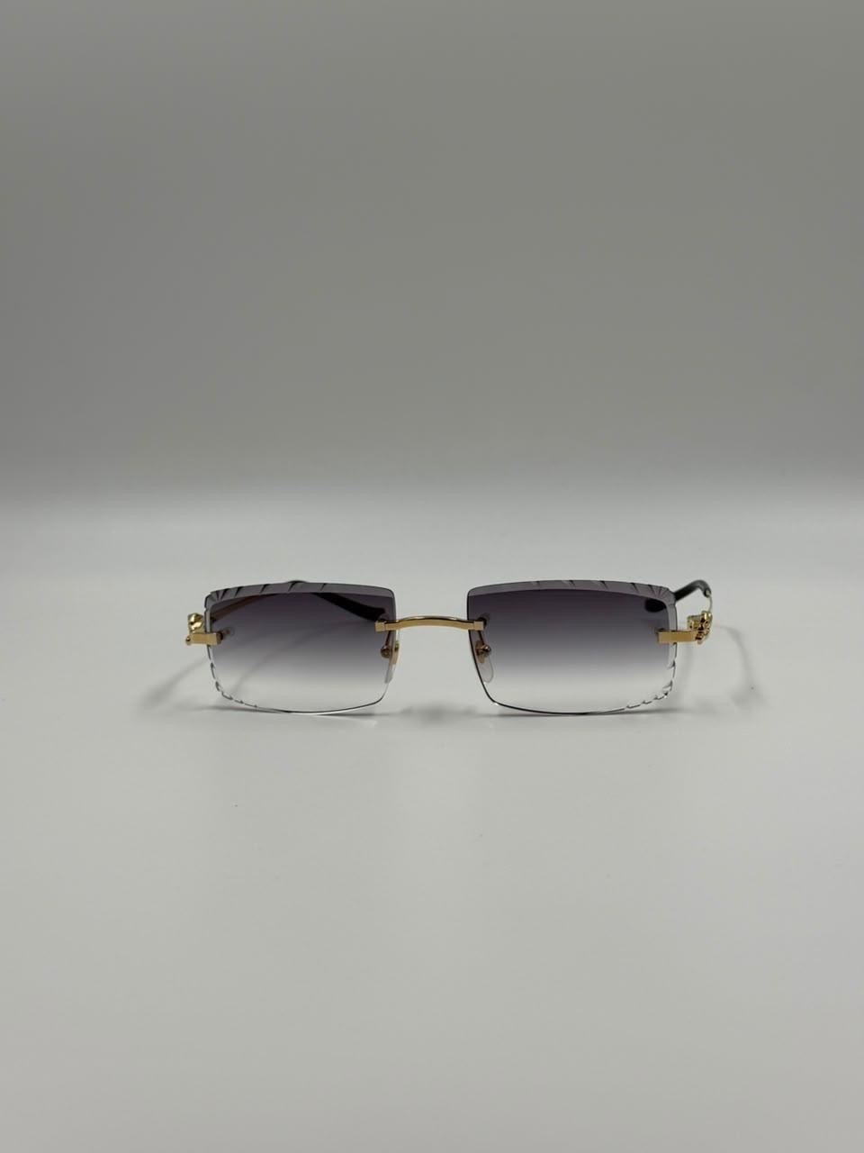 Dark sunglasses against a neutral backdrop