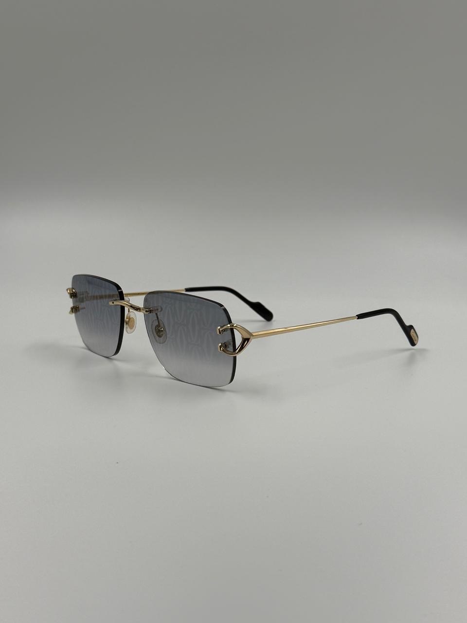 Cool-tinted sunglasses on a light backdrop