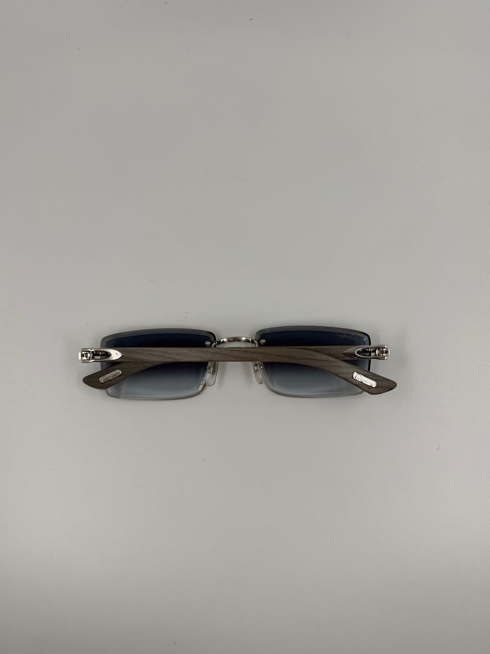 Dark narrow sunglasses on a studio background