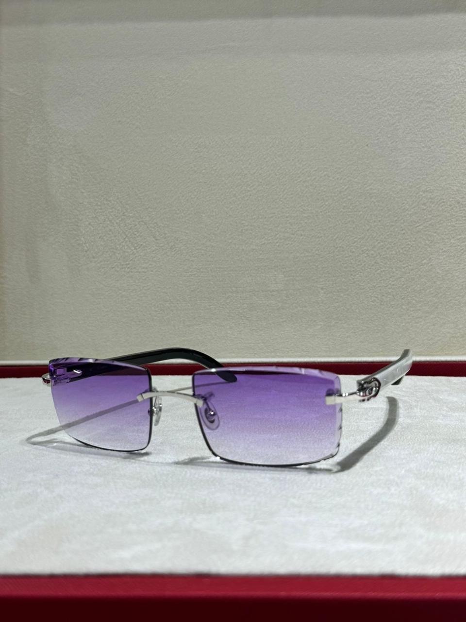Purple-tinted rimless sunglasses