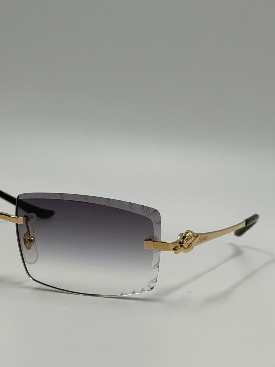 Dark-lensed eyewear on a pale surface