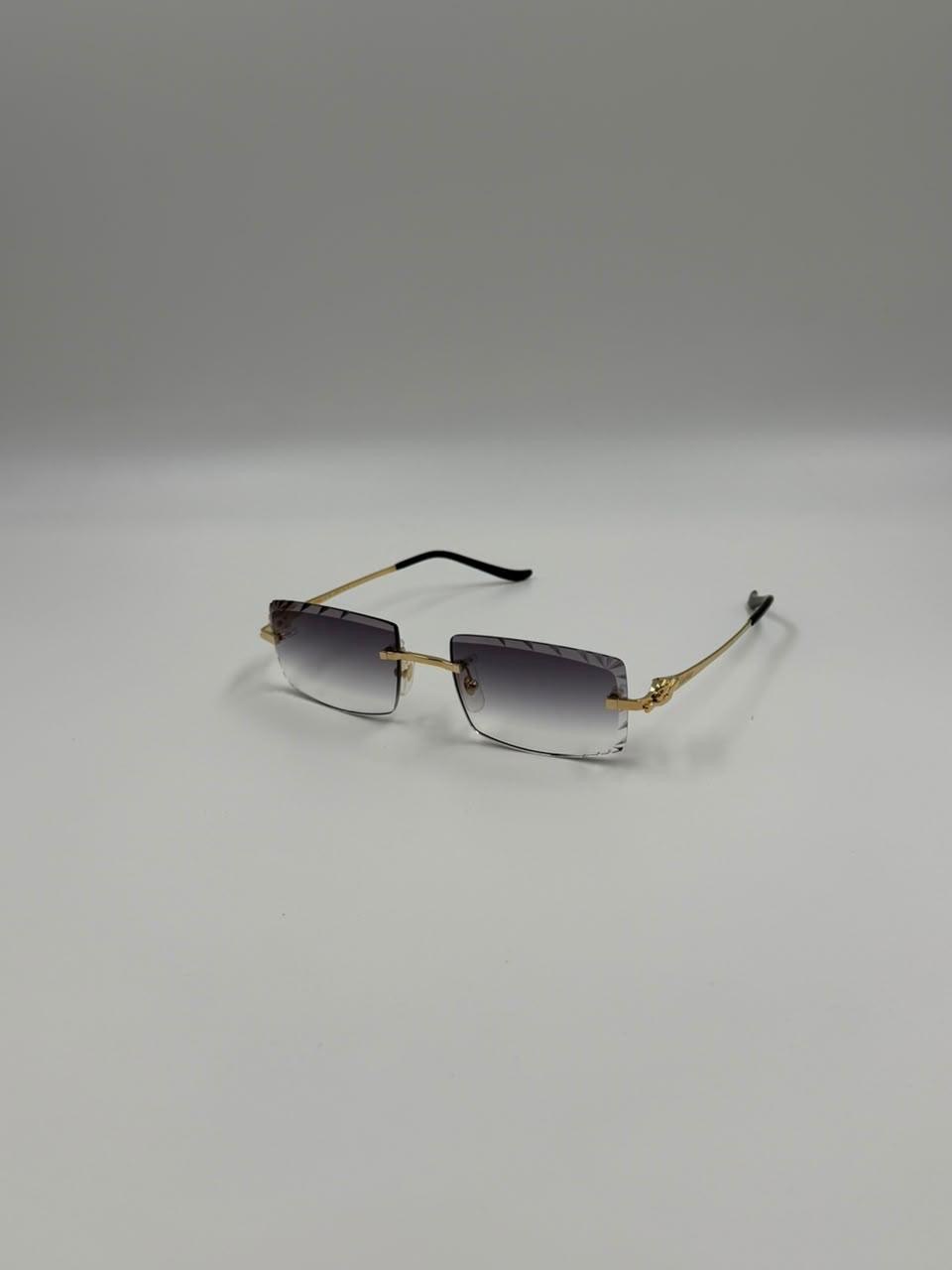 Minimal metal eyewear on a pale surface