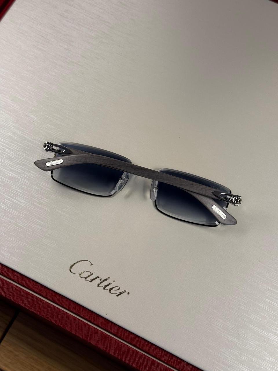 Dark sunglasses on a display surface