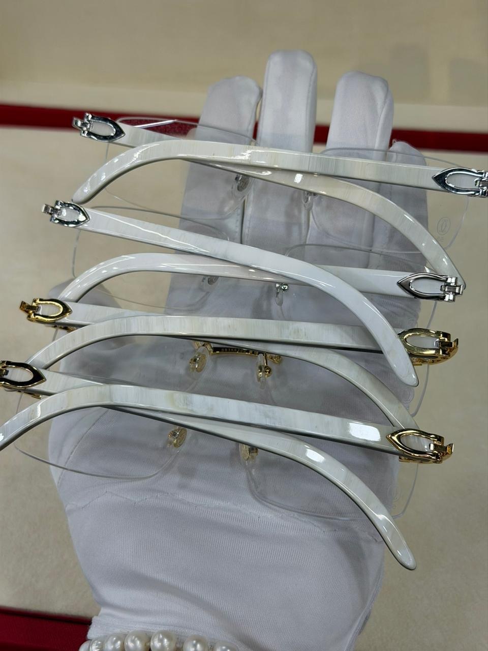 Several eyewear frames displayed together